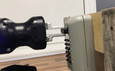 Universal Robots cobot collaborative robot and electronic gripper quality testing a key safe